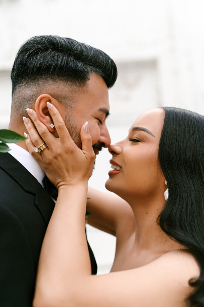 Close up of the bride and groom smiling before they're about to kiss, photographed by Chelsea Schmidt Photography.